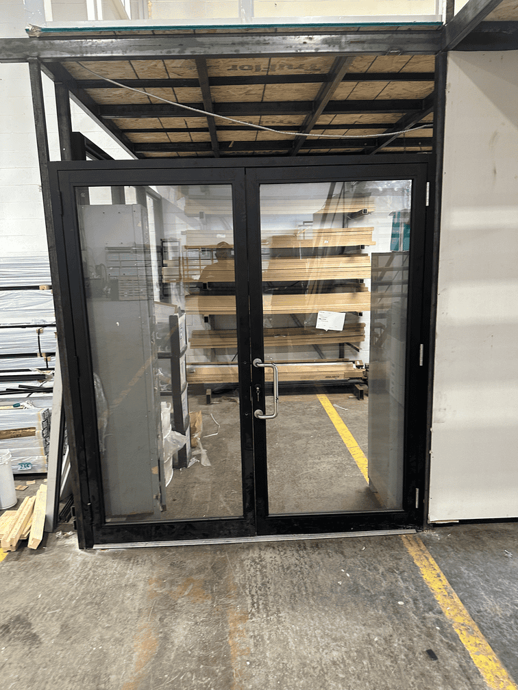 A finished aluminum-framed commercial glass entry door, installed by the Glass 911 crew