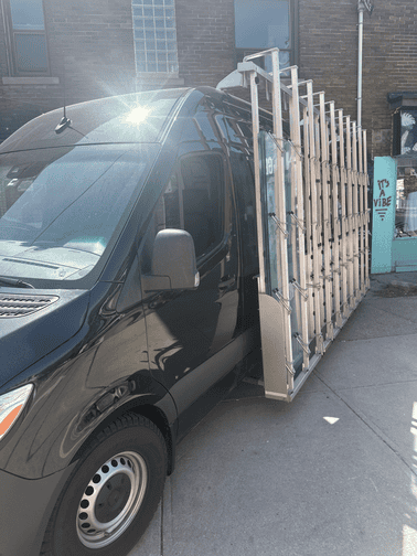 Common entry glass loaded on the rack of the Glass 911 work truck.