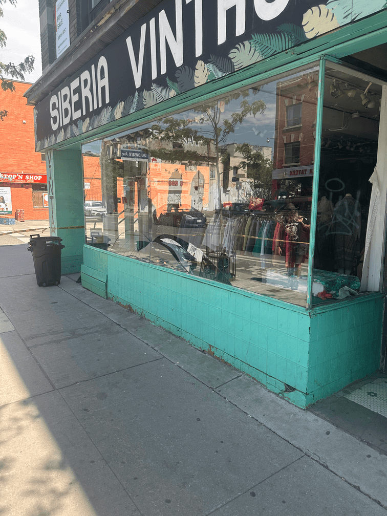 A storefront display window intact, before a break-in, on a Toronto street